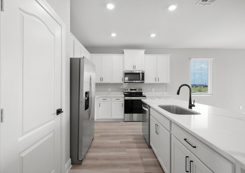 The kitchen comes with a full suite of stainless steel appliances!