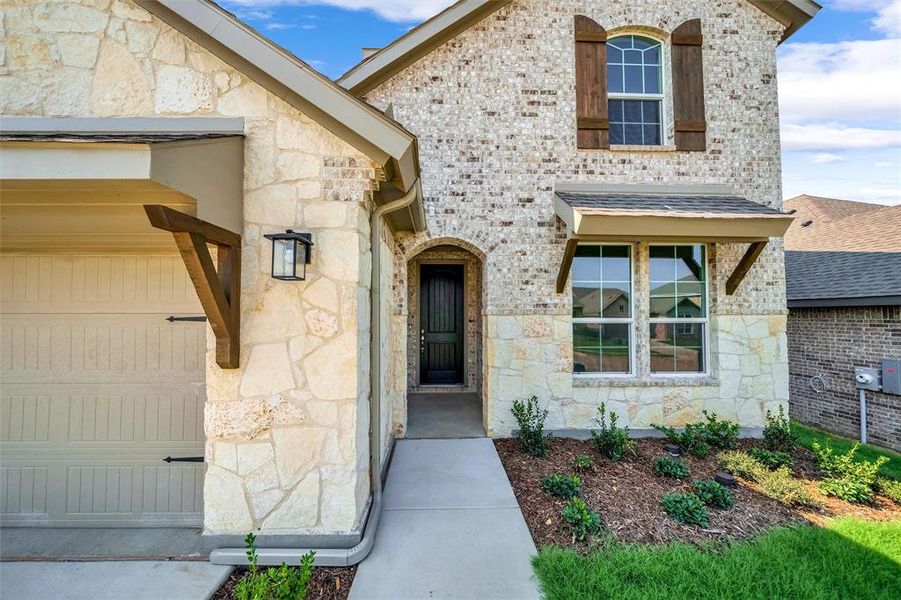 Front exterior of a new home in Liberty Pointe, Gainesville, TX, highlighting curb appeal (Image 1). Front exterior of a new home in Liberty Pointe, Gainesville, TX, highlighting curb appeal (Image 1).