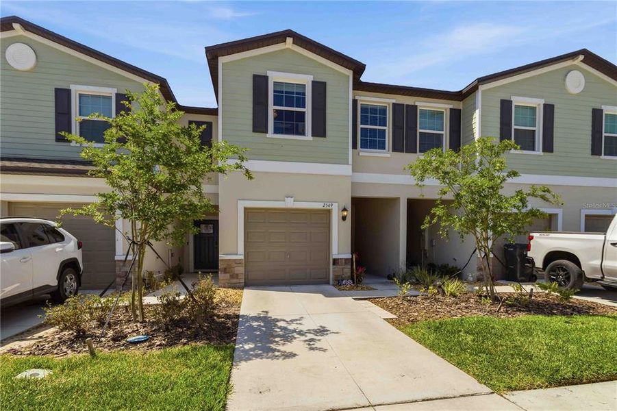 Front exterior of a new home in , Ruskin, FL, highlighting curb appeal (Image 23).