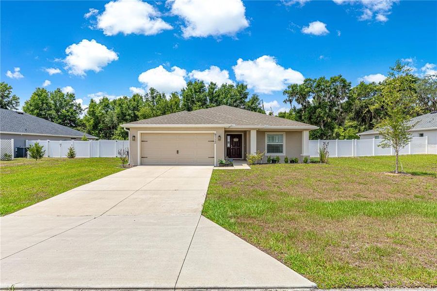 Front exterior of a new home in , Ocala, FL, highlighting curb appeal (Image 1). Front exterior of a new home in , Ocala, FL, highlighting curb appeal (Image 1).
