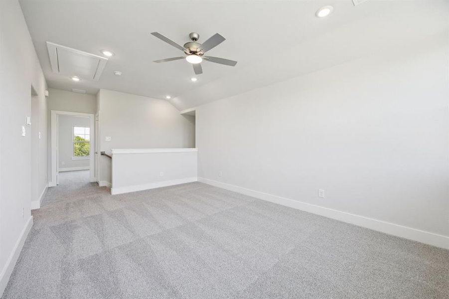 Empty room with light colored carpet, recessed lighting, ceiling fan, and attic access