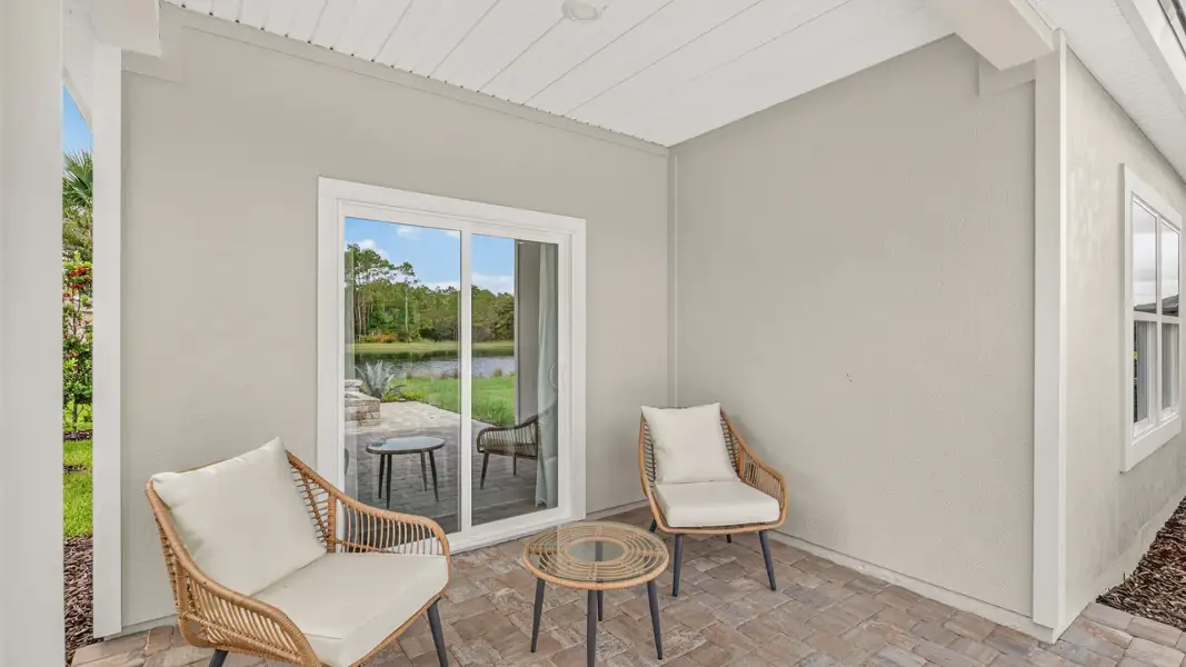 Exterior details and patio area of a home in American Village, Palm Coast (Image 2).