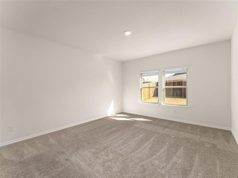 Unfurnished room featuring carpet