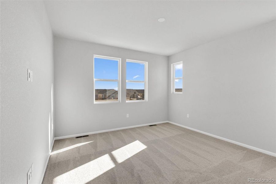 Spacious, unfurnished interior of a new home in The Legacy Collection at Talon Pointe, Thornton (Image 14).