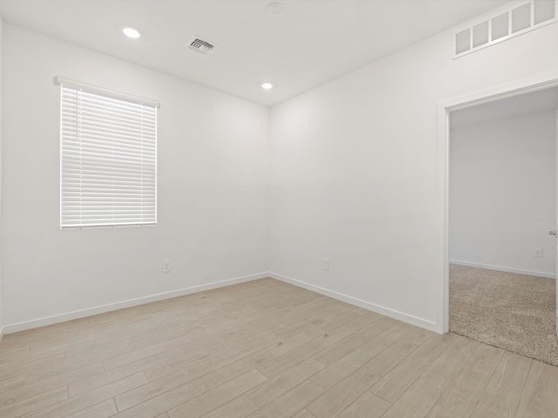Spacious, unfurnished interior of a new home in Rancho Mirage Estate Series, Maricopa (Image 9).