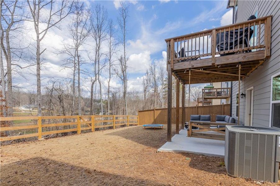 Exterior details and patio area of a home in Creekside at Farmers Crossing, Ball Ground (Image 28).