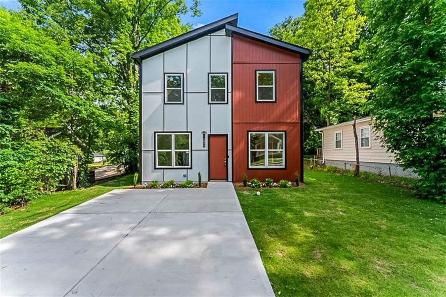 Front exterior of a new home in , East Point, GA, highlighting curb appeal (Image 2). Front exterior of a new home in , East Point, GA, highlighting curb appeal (Image 2).
