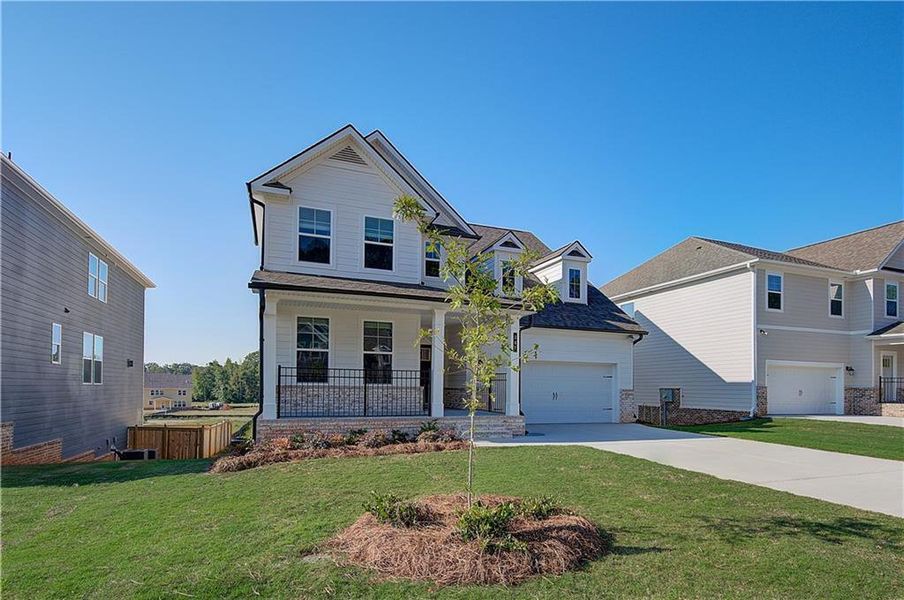 Front exterior of a new home in Cooper Park, McDonough, GA, highlighting curb appeal (Image 15). Front exterior of a new home in Cooper Park, McDonough, GA, highlighting curb appeal (Image 15).