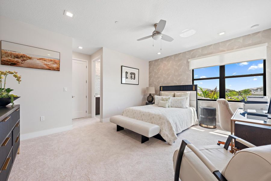 Large 14' x 13' bedroom with an en-suite bathroom and walk-in closet.