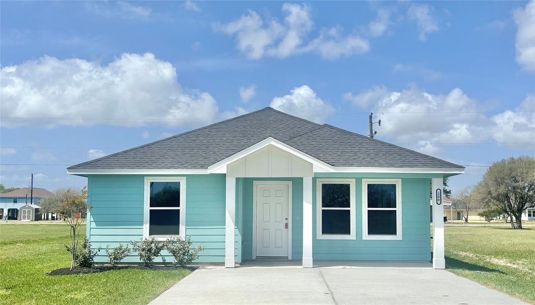 Front exterior of a new home in , Palacios, TX, highlighting curb appeal (Image 2).