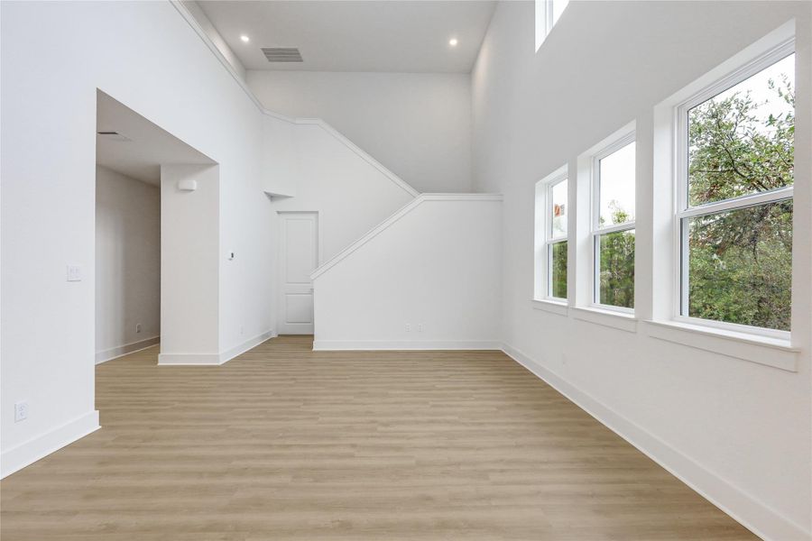 Open Living area with sky high ceilings.