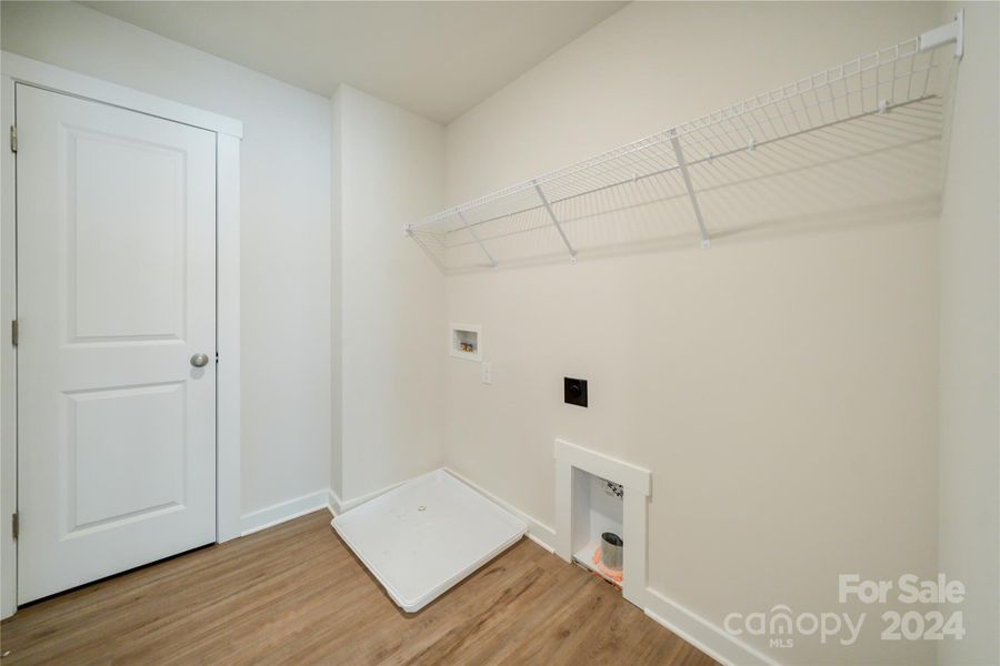 Laundry Room with closet for storage.