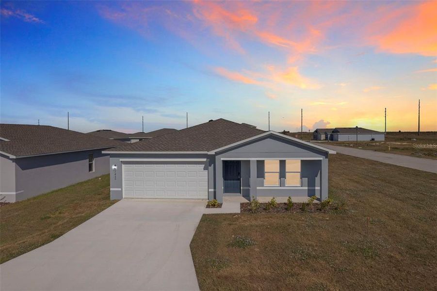 Front exterior of a new home in Stone Ridge, Sebring, FL, highlighting curb appeal (Image 2).