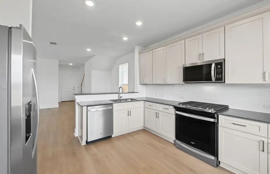 Furnished interior view inside a new home in Crosswinds, Kyle (Image 5).