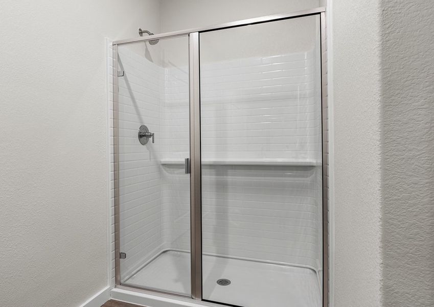 The master bathroom has a glass, walk-in shower.