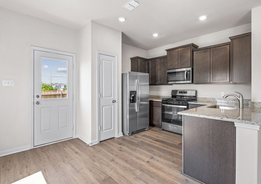 The kitchen has a pantry for additional storage.