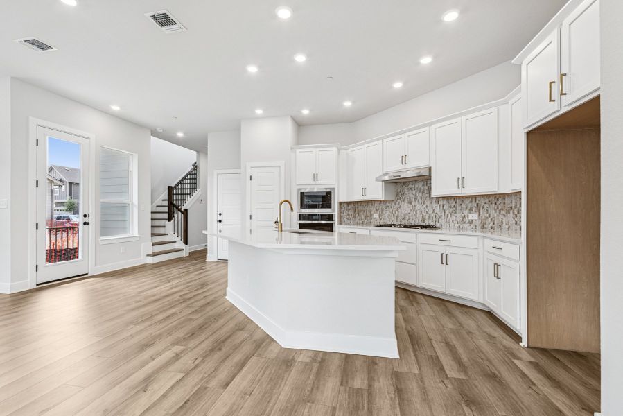 Furnished interior view inside a new home in Double Creek Crossing – Craftsman Series, Round Rock (Image 6). Furnished interior view inside a new home in Double Creek Crossing – Craftsman Series, Round Rock (Image 6).