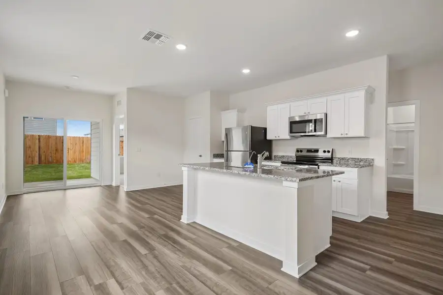 Representative furnished interior of a home built from the Odyssey by Starlight Homes in Oakfield Lakes, Parrish (Image 7).