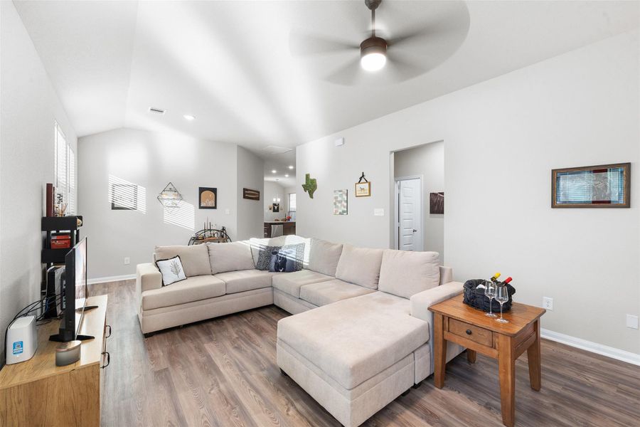 This spacious living room offers lots of natural light creating a bright and airy atmosphere. The neutral walls offer a versatile backdrop for decor, making it a cozy and welcoming space for relaxation.