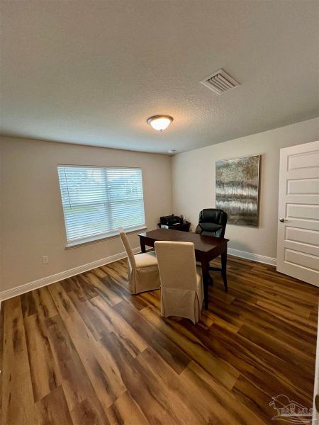 Furnished interior in a model home at Muldoon Pointe in Pensacola (Image 11).
