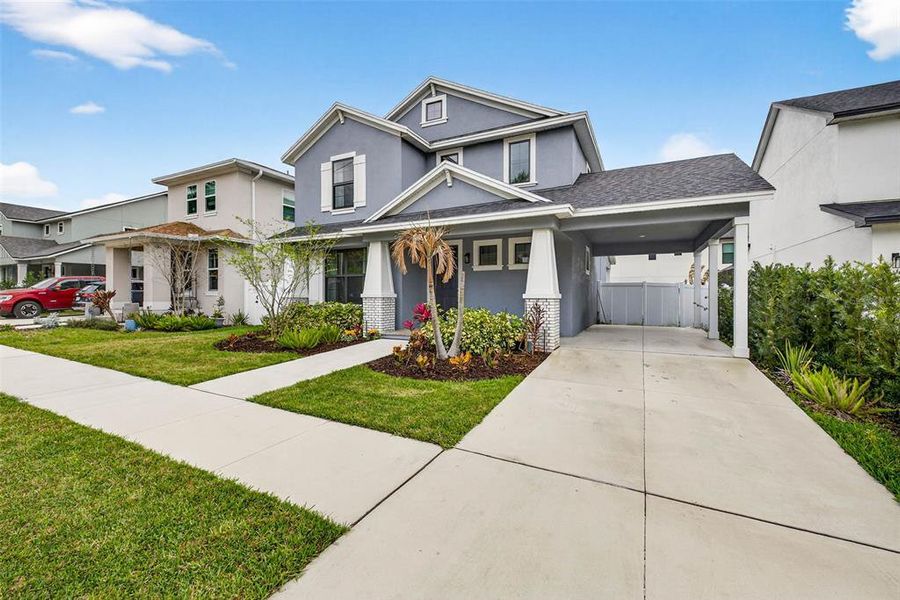Front exterior of a new home in Clearfield Crossings, Tampa, FL, highlighting curb appeal (Image 28).