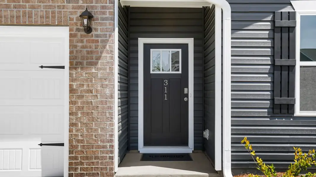 Exterior details and patio area of a home in Hunters Ridge, Woodruff (Image 4).