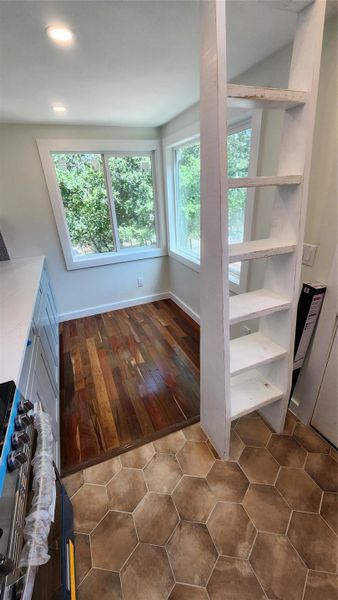 Extremely durable character grade IPE (Brazilian Walnut) flooring in living room and up in 7' x 7' lofts. Extremely durable character grade IPE (Brazilian Walnut) flooring in living room and up in 7' x 7' lofts.