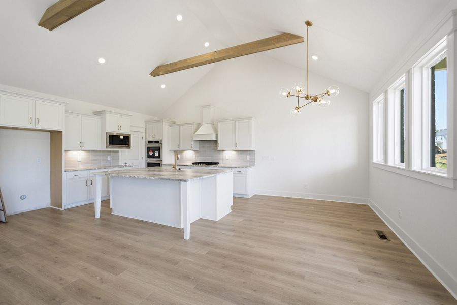 Furnished interior view inside a new home in Aden Woods, Fairview (Image 8).