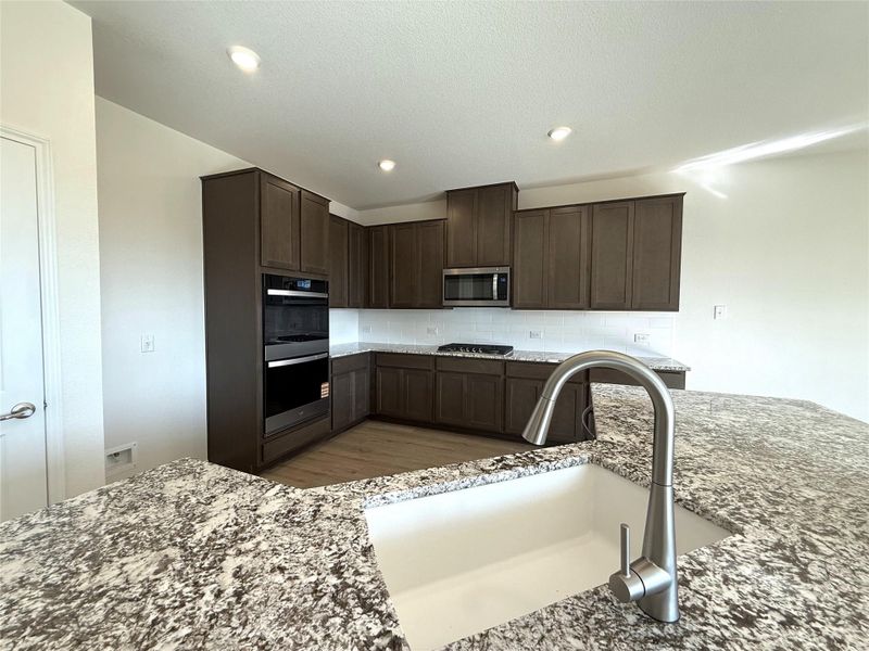 Furnished interior view inside a new home in River Bluff, Leander (Image 10).