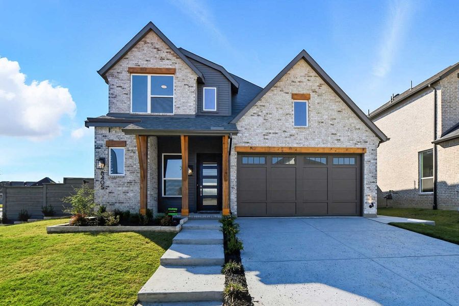 Front exterior of a new home in Treeline, Justin, TX, highlighting curb appeal (Image 1).
