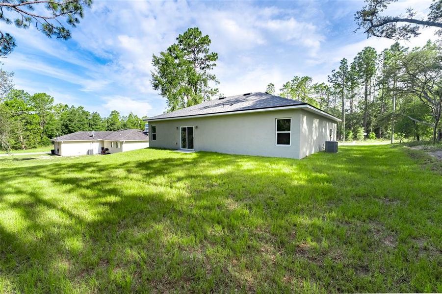 Front exterior of a new home in , Citrus Springs, FL, highlighting curb appeal (Image 9).