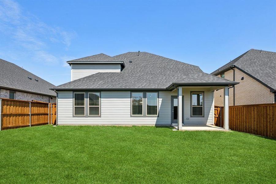 Backyard in the Masters home plan by Trophy Signature Homes – REPRESENTATIVE PHOTO