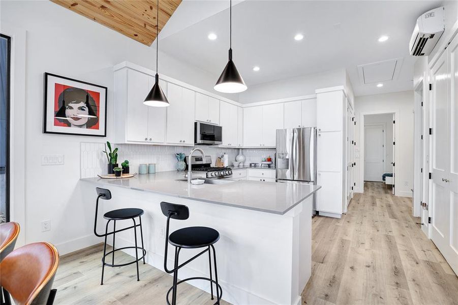 Gleaming stainless steel appliances add a touch of contemporary flair, to the clean lines of this kitchen, enhancing both the aesthetics and functionality of the space.