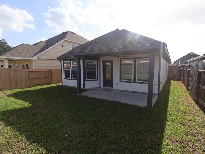 Exterior details and patio area of a home in Pinewood at Grand Texas, New Caney (Image 16). Exterior details and patio area of a home in Pinewood at Grand Texas, New Caney (Image 16).