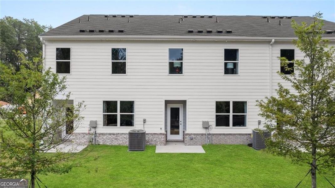 Exterior details and patio area of a home in Young's Crossing, Stone Mountain (Image 3).