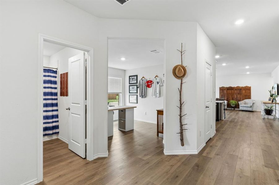 Hallway featuring dark wood-style floors and recessed lighting Hallway featuring dark wood-style floors and recessed lighting