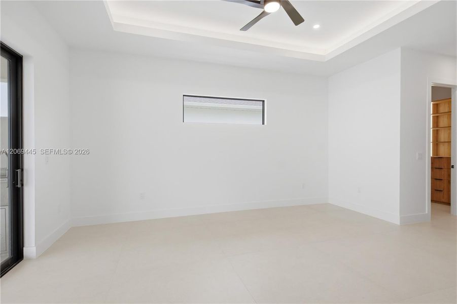 Private primary bedroom features direct access to custom-designed walk-in closets. Private primary bedroom features direct access to custom-designed walk-in closets.