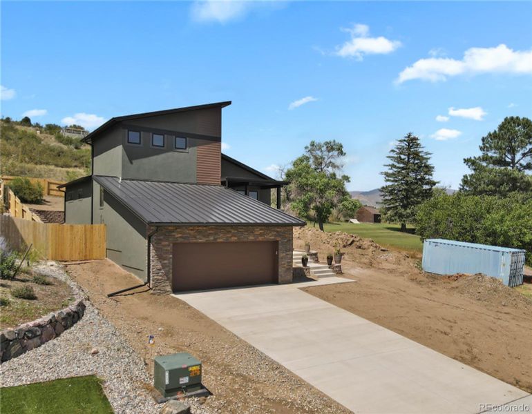 Front exterior of a new home in , Colorado Springs, CO, highlighting curb appeal (Image 1). Front exterior of a new home in , Colorado Springs, CO, highlighting curb appeal (Image 1).