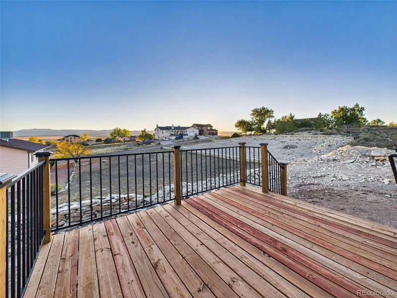 Wood deck with mountain backdrop—perfect for entertaining or relaxing outdoors. Wood deck with mountain backdrop—perfect for entertaining or relaxing outdoors.