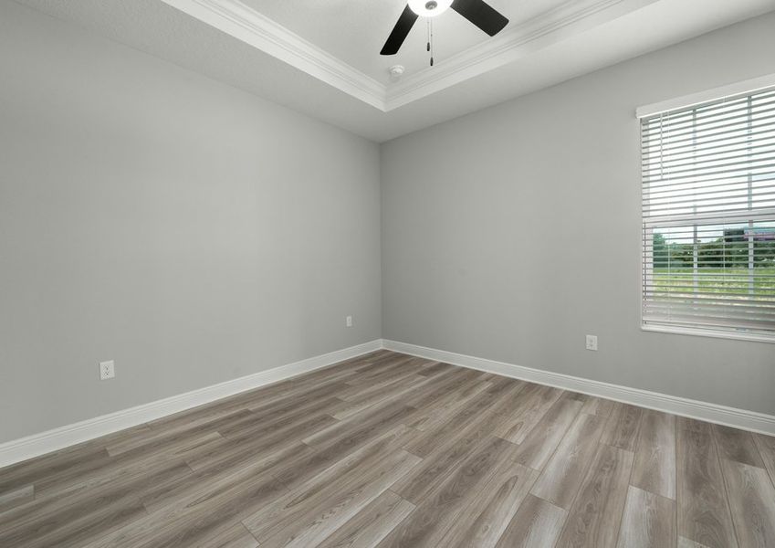 Master bedroom with a ceiling fan
