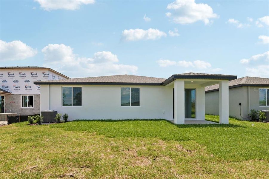 Exterior details and patio area of a home in Two Rivers - Classic Series, Zephyrhills (Image 3).