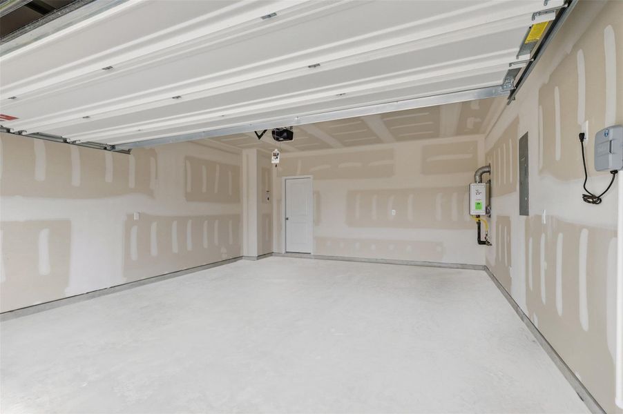 Interior view of the garage reveals a clean, well finished space with ample room for vehicles, storage, and hobbies, designed for functionality while maintaining a neat and organized feel, make this home yours today! Interior view of the garage reveals a clean, well finished space with ample room for vehicles, storage, and hobbies, designed for functionality while maintaining a neat and organized feel, make this home yours today!