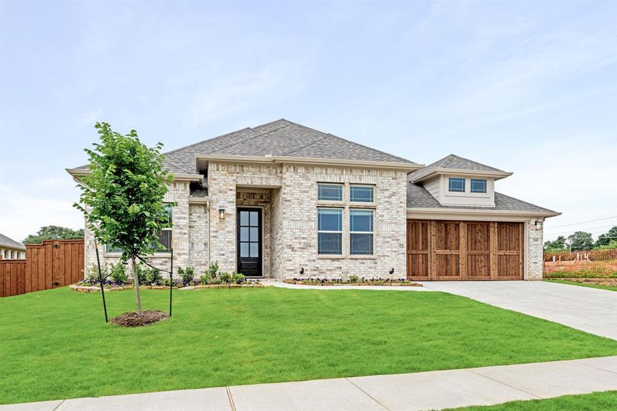 Front exterior of a new home in Rockwood 65, Mansfield, TX, highlighting curb appeal (Image 1).