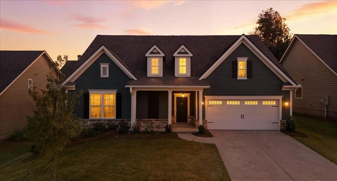 Front exterior of a new home in Traditions of Braselton, Jefferson, GA, highlighting curb appeal (Image 24).