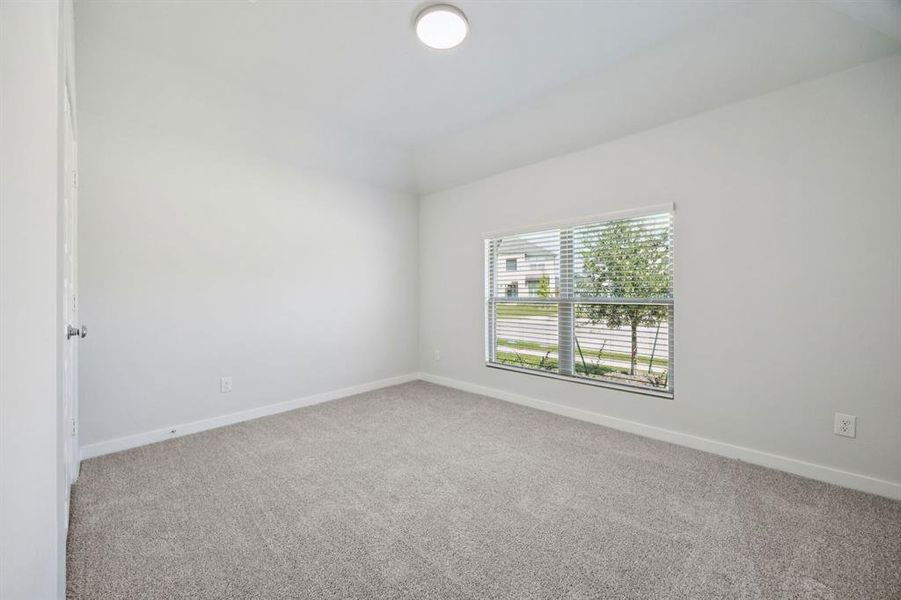 Bedroom in the Heisman home plan by Trophy Signature Homes – REPRESENTATIVE PHOTO