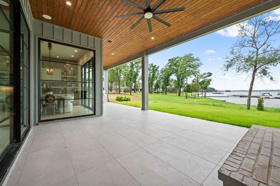 View of patio / terrace featuring a water view and ceiling fan View of patio / terrace featuring a water view and ceiling fan