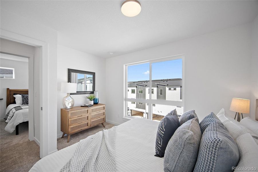 Furnished interior view inside a new home in The Commons at Victory Ridge, Colorado Springs (Image 21).