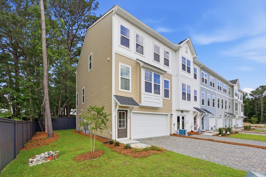 Front exterior of a new home in Rhetts Cove, Johns Island, SC, highlighting curb appeal (Image 1). Front exterior of a new home in Rhetts Cove, Johns Island, SC, highlighting curb appeal (Image 1).