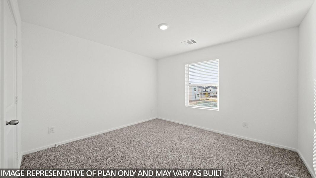 Neutral tone walls with gray carpet flooring, recessed lighting, and a single window with blinds