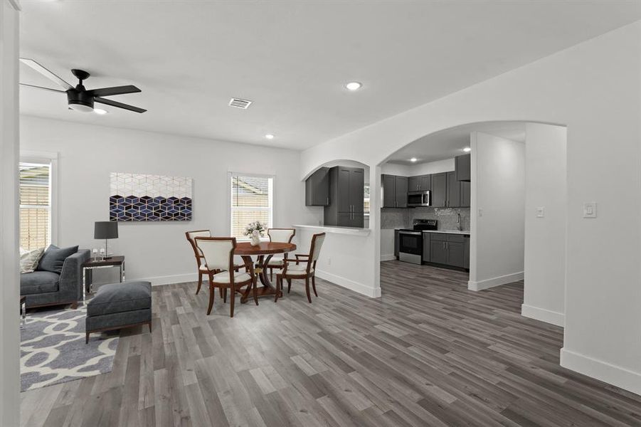 Virtually Staged: Easy access between the main living areas and the kitchen.